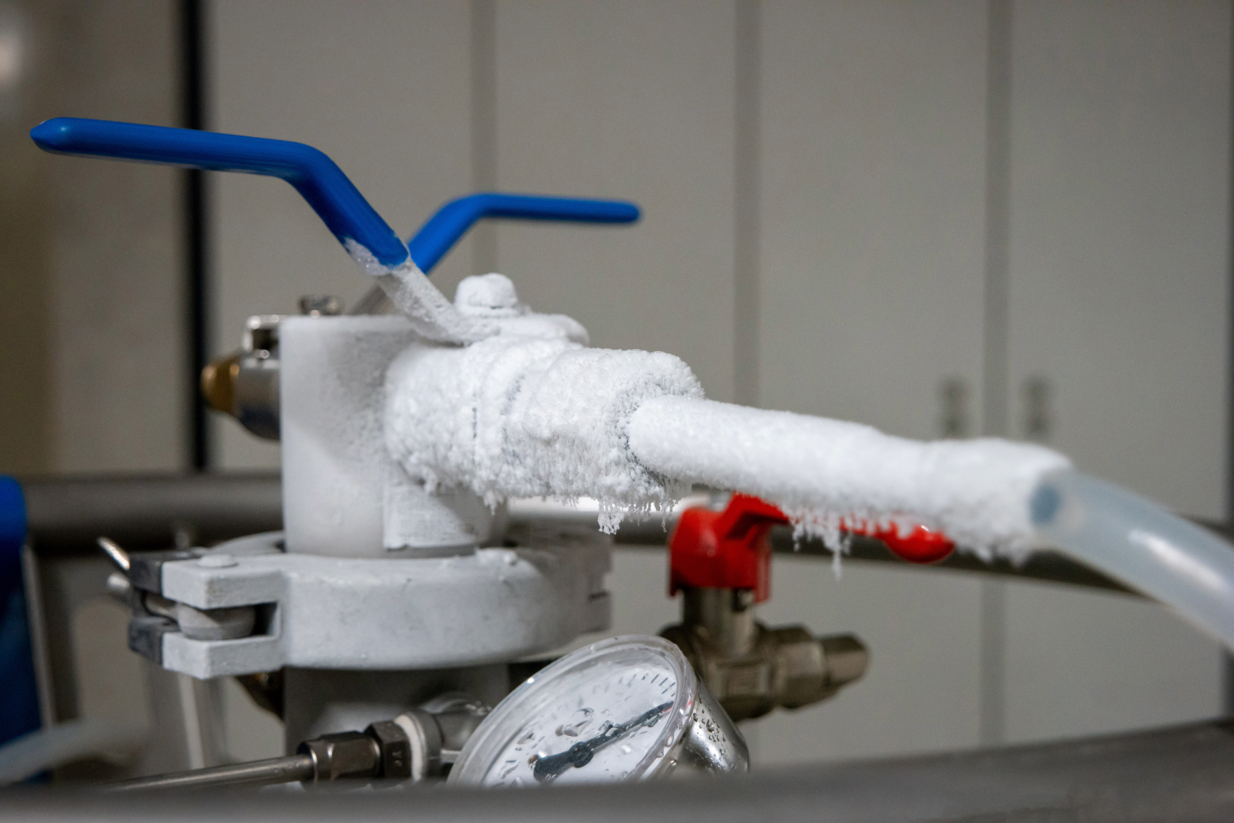 Frozen pipe with blue handles. Cold weather can freeze pipes. Have a plan so your facility is ready for water events. 